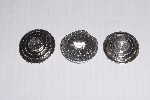 Before and after of cast pewter Imperial Officer disks